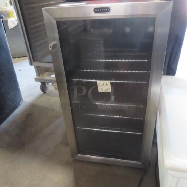 One Whynter Countertop Glass Display Cooler With 2 Racks. 120 Volt. Model# BR-130SB. 17X19X32. $505.00. - Image 1 of 3