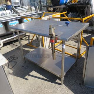 One Stainless Steel Table With SS Under Shelf And A Edlund 10lb Can Opener. 48X30X36