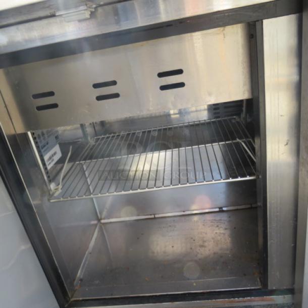 One Turbo Air 3 Door Refrigerated Prep Table With Cutting Board ANd 3 Racks, On Casters. Model# TST-72SD-30-N. 115 Volt. 73X34X45 - Image 2 of 2