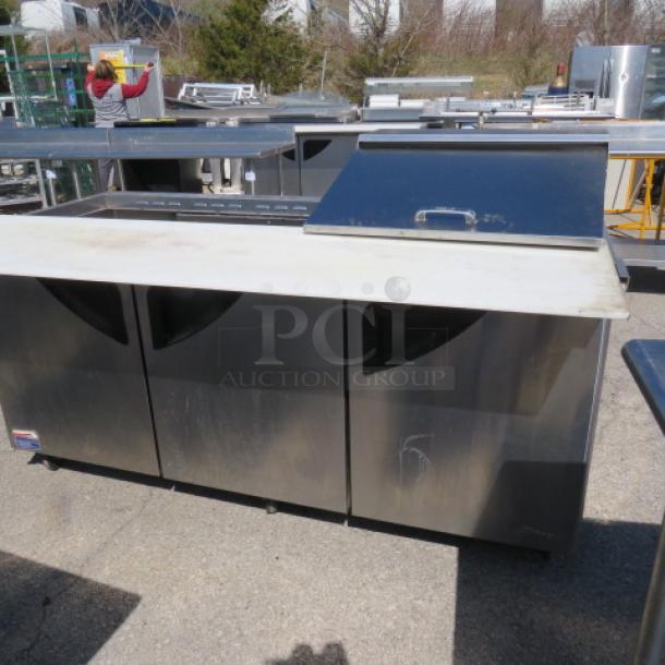 One Turbo Air 3 Door Refrigerated Prep Table With Cutting Board And 3 Racks, On Casters. Missing 1 Lid. Model# TST-72SD-30-N. 115 Volt. 73X34X45 - Image 2 of 4