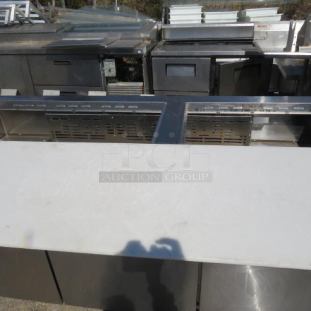 One Turbo Air 3 Door Refrigerated Prep Table With Cutting Board And 3 Racks, On Casters. Missing 2 Lids. Model# TST-72SD-30-N. 115 Volt. 73X34X45 - Image 2 of 3