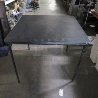 One Black Metal Folding Card Table.