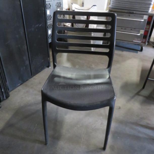 Black Stack Indoor/Outdoor Chair. 2XBID - Image 1 of 1