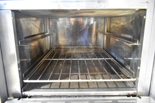 Radiance Stainless Steel Commercial Natural Gas Powered Flat Top Griddle w/ 2 Burners, 2 Ovens, Back Splash and Over Shelf. - Image 7 of 10