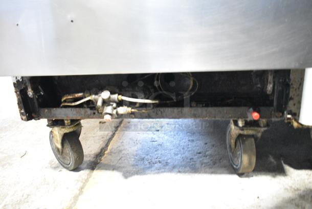 Stainless Steel Commercial Gas Powered 4 Burner Range w/ Oven, Over Shelf and Back Splash on Commercial Casters. - Image 7 of 8