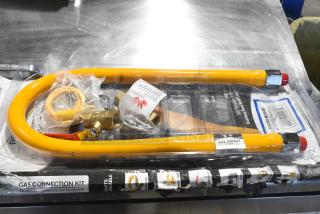 BRAND NEW SCRATCH AND DENT! Dormont 600GKM3448 48" Mobile Gas Connector Hose Kit with 2 Elbows, Full Port Valve, Restraining Device, and Quick Disconnect - 3/4"