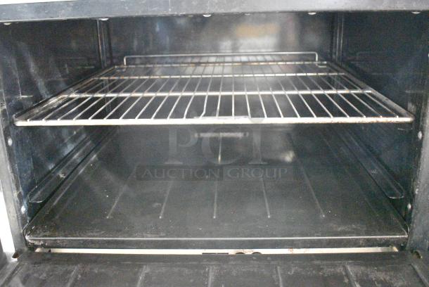Imperial IR-6-G24 Stainless Steel Commercial Natural Gas Powered 6 Burner Range w/ Flat Top Griddle, 2 Ovens, Over Shelf and Back Splash on Commercial Casters. - Image 7 of 12