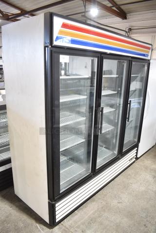 True GDM-72F Metal Commercial 3 Door Reach In Freezer Merchandiser w/ Poly Coated Racks. 115/208-230 Volts, 1 Phase. - Item #1171847