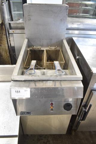 Pitco Frialator Stainless Steel Commercial Floor Style Natural Gas Powered Deep Fat Fryer w/ 2 Metal Fry Baskets on Commercial Casters.