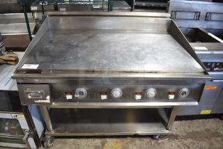 Keating MiraClean Stainless Steel Commercial Chrome Top Flat Top Griddle w/ Under Shelf on Commercial Casters.