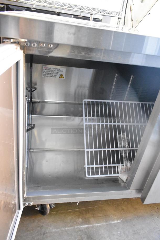 BRAND NEW SCRATCH AND DENT! 2023 Avantco 178SSUC72RHC Stainless Steel Commercial 3 Door Undercounter Cooler on Commercial Casters. 115 Volts, 1 Phase. Tested and Working! - Image 5 of 9