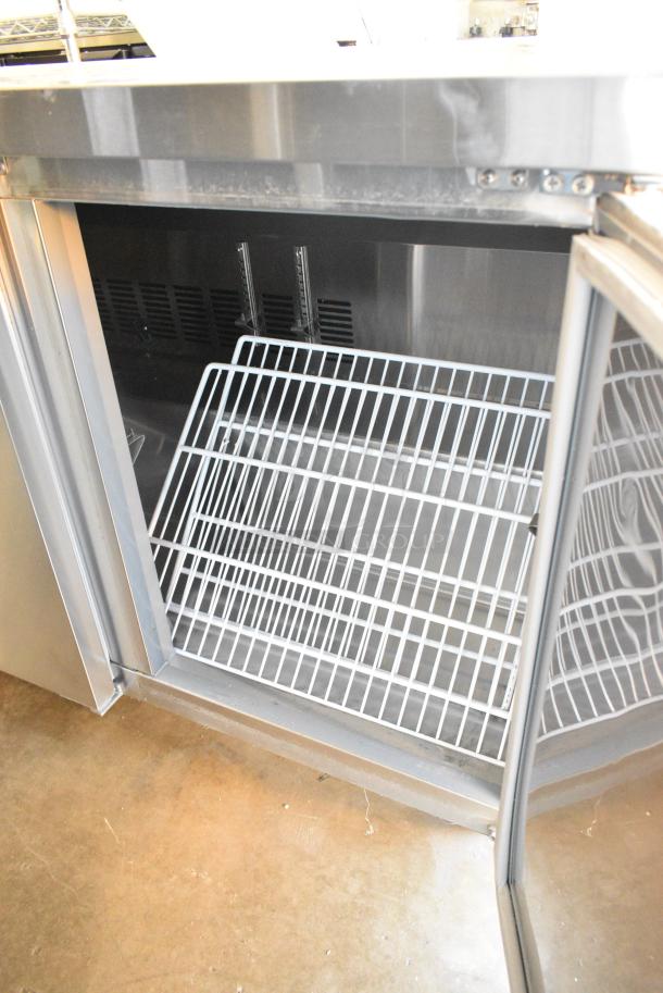 BRAND NEW SCRATCH AND DENT! 2023 Avantco 178SSUC72RHC Stainless Steel Commercial 3 Door Undercounter Cooler on Commercial Casters. 115 Volts, 1 Phase. Tested and Working! - Image 7 of 9