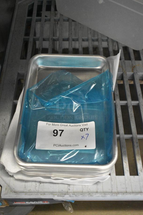7 BRAND NEW SCRATCH AND DENT! 407BUNEGHT Baker's Lane Eighth Size 19 Gauge Non-Stick 6 1/2" x 9 1/2" Light Blue Wire in Rim Aluminum Bun / Sheet Pan / Tray. 7 Times Your Bid! - Image 1 of 4