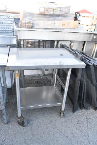 Stainless Steel Table w/ Under Shelf on Commercial Casters.