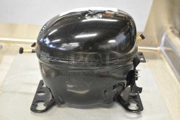 BRAND NEW SCRATCH AND DENT! Embraco EMC3134U Compressor. 115-127 Volts, 1 Phase. - Image 1 of 5