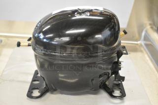 BRAND NEW SCRATCH AND DENT! Embraco EMC3134U Compressor. 115-127 Volts, 1 Phase.