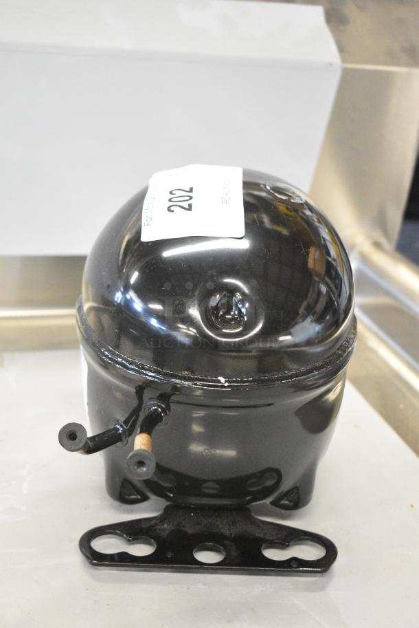 BRAND NEW SCRATCH AND DENT! Embraco EMC3134U Compressor. 115-127 Volts, 1 Phase. - Image 3 of 5