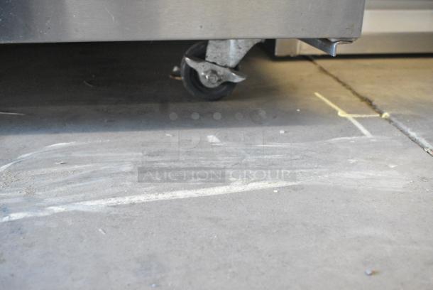 True TSSU-72-30M-B-ST Stainless Steel Commercial Sandwich Salad Prep Table Bain Marie Mega Top on Commercial Casters. 115 Volts, 1 Phase. Tested and Powers On But Does Not Get Cold - Image 4 of 10