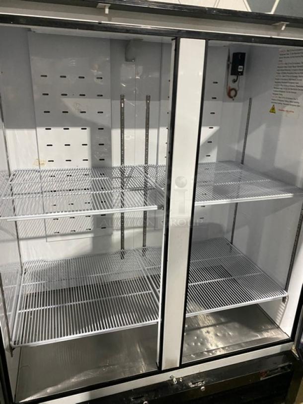 Migali Commercial Black Double Glass Swing Door Reach In Merchandiser Freezer! With Poly Coated Wire Racks! Model: C-49FM-HC SN: C-49FM-HC00318110900920002! 115V 1 Phase! - Image 4 of 7