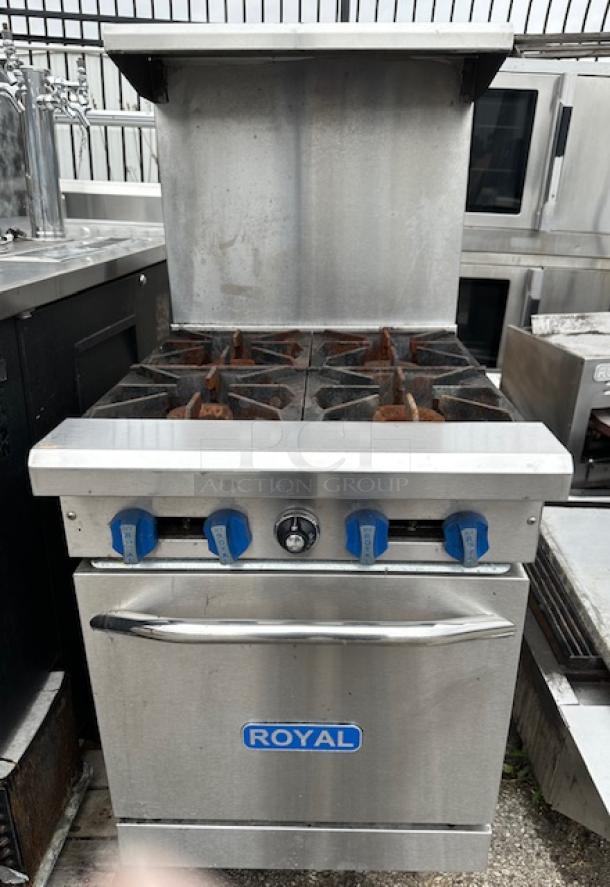 One Royal Natural Gas 4 Burner Range With Stainless Steel Over Shelf, And 1 Rack On Casters. Model# RR-4. 24X32X57.  $3165.00. - Image 1 of 1