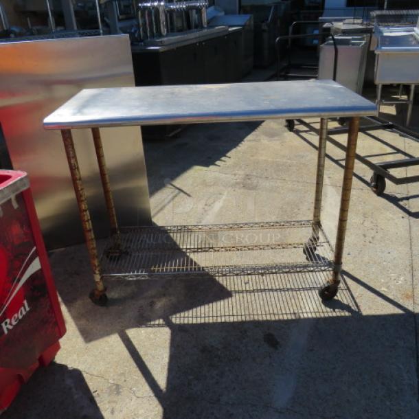 One Stainless Steel Table With A Metro Under Shelf On Casters. 49.5X24X40 - Image 1 of 1