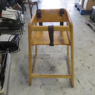 One Wooden High Chair With Straps.