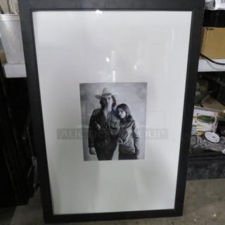 One 27X39 Framed Matted Picture.