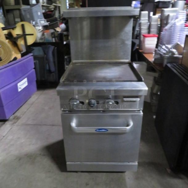 One Atosa Cook Rite Natural Gas Griddle Range With A SS Over Shelf, And 1 Rack On Casters.  Model# ATO-24G. 24X32X57. $1878.00 - Image 1 of 4