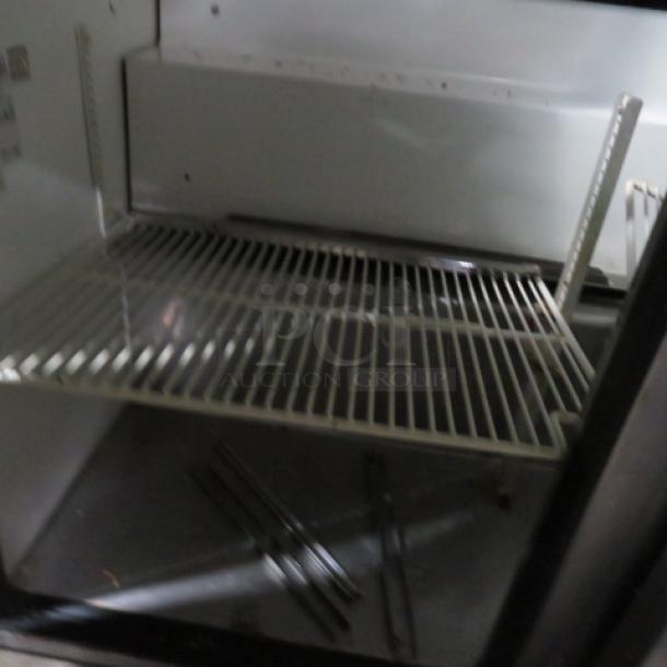 One WORKING True 3 Door Refrigerated Prep Table With 3 Racks, Cutting Board, And SS Over Shelf With A Lift Top, On Casters. Model# TSSU-72-30M-B-ST. 115 Volt. 72X35X60.5. $5764.77. - Image 3 of 3