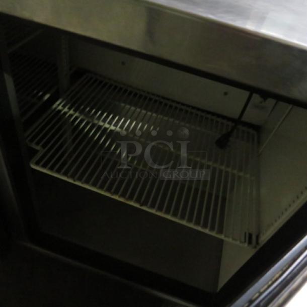 One True 2 Door Refrigerated Prep Table With 2 Racks On Casters. WORKING NOT COLD. Model# TSSU-48-12. 115 Volt. 48X30X43. $3978.00 - Image 2 of 2