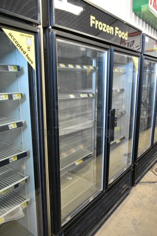 True GDM-49F-LD Metal Commercial 2 Door Reach In Freezer Merchandiser w/ Poly Coated Racks. 115/208-230 Volts, 1 Phase. Tested and Working!