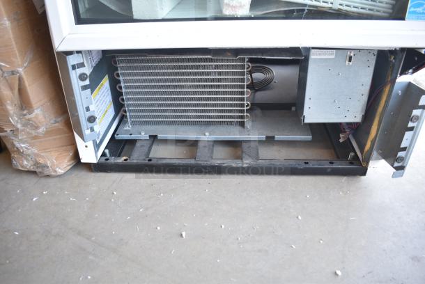 BRAND NEW SCRATCH AND DENT! 2024 True TSCI-600R-G-PH Metal Commercial Single Door Reach In Cooler Merchandiser w/ Poly Coated Racks. 115 Volts, 1 Phase. Tested and Working! - Image 3 of 10