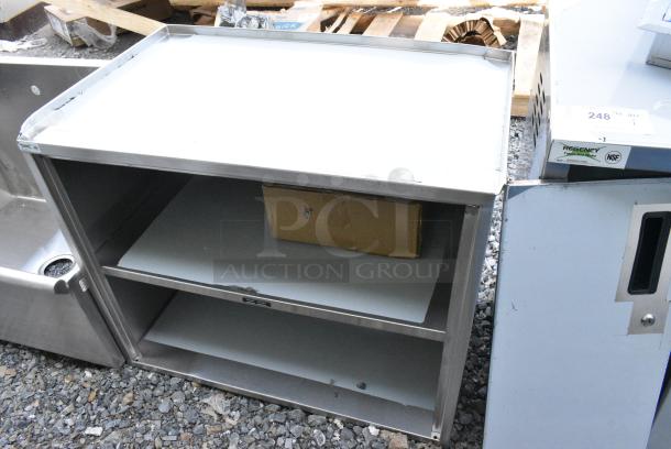 BRAND NEW SCRATCH AND DENT! Regency 600CT3S2133E 21" x 33" Three Shelf 18-Gauge 304 Stainless Steel Utility Cart with Enclosed Base and Open Front - Image 2 of 7