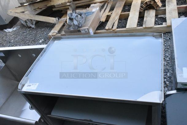 BRAND NEW SCRATCH AND DENT! Regency 600CT3S2133E 21" x 33" Three Shelf 18-Gauge 304 Stainless Steel Utility Cart with Enclosed Base and Open Front - Image 3 of 7