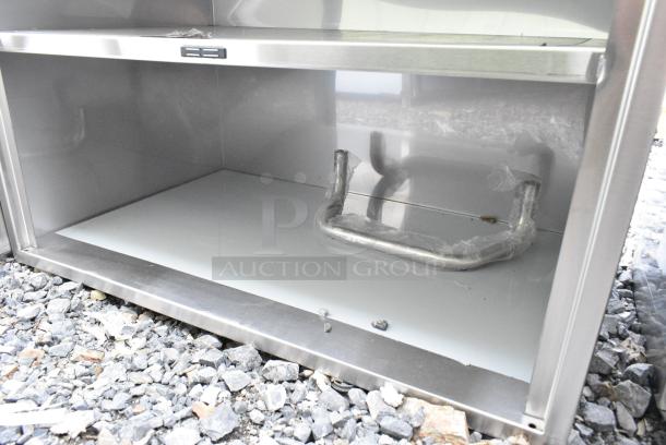 BRAND NEW SCRATCH AND DENT! Regency 600CT3S2133E 21" x 33" Three Shelf 18-Gauge 304 Stainless Steel Utility Cart with Enclosed Base and Open Front - Image 6 of 7