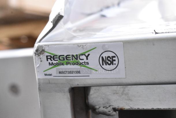 BRAND NEW SCRATCH AND DENT! Regency 600CT3S2133E 21" x 33" Three Shelf 18-Gauge 304 Stainless Steel Utility Cart with Enclosed Base and Open Front - Image 7 of 7
