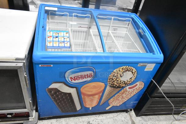 AHT RIO S 100 Metal Commercial 2 Door Chest Freezer Merchandiser w/ Baskets on Commercial Casters. 115 Volts, 1 Phase. Tested and Working! - Image 1 of 7