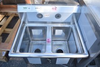 BRAND NEW SCRATCH AND DENT! Regency 600S21014 27" 16-Gauge Stainless Steel Two Compartment Commercial Sink with Galvanized Steel Legs and without Drainboard - 10" x 14" x 12" Bowls. No Legs.