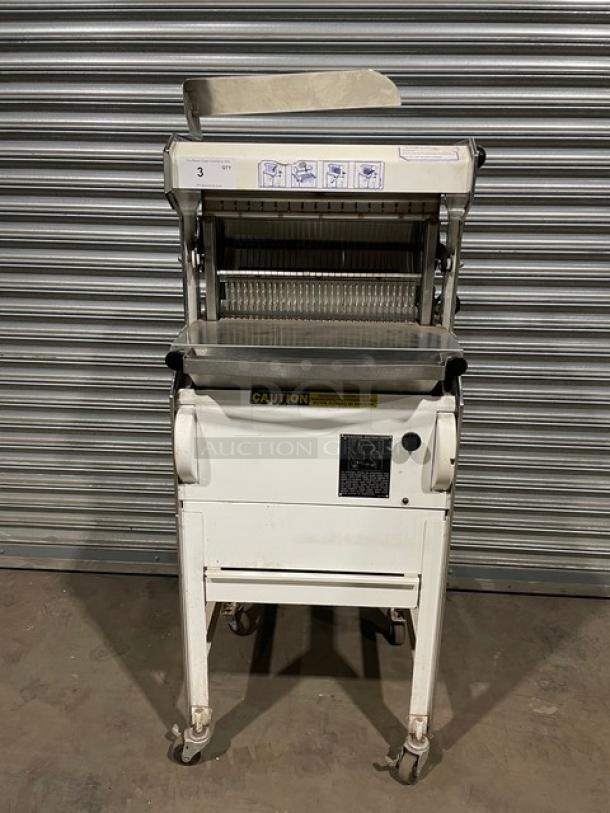 Oliver Commercial White Electric Powered Heavy Duty Variety Bread Slicer! With Stainless Steel Worktop! Model: 777 SN: 169019! 115V 1 Phase! On Casters! WORKING WHEN REMOVED! - Image 1 of 10