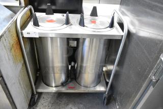 AMF Wyott Stainless Steel Commercial 2 Well Plate Dispenser on Commercial Casters. 120 Volts, 1 Phase. Tested and Working!