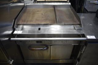 Southbend Stainless Steel Commercial Natural Gas Powered Flat Top Griddle w/ Convection Oven on Commercial Casters.