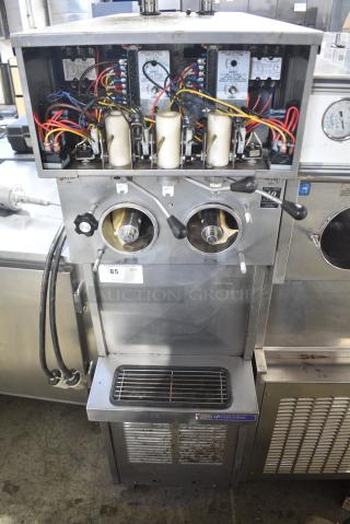 Stoelting 237R-109G Stainless Steel Commercial Floor Style 2 Flavor w/ Twist Soft Serve Ice Cream Machine on Commercial Casters. 208/230 Volts, 3 Phase.