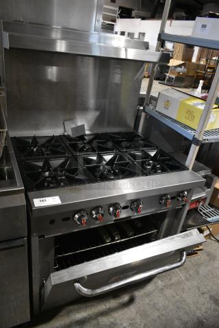 Cooking Performance Group Stainless Steel Commercial Natural Gas Powered 6 Burner Range w/ Oven and Back Splash.