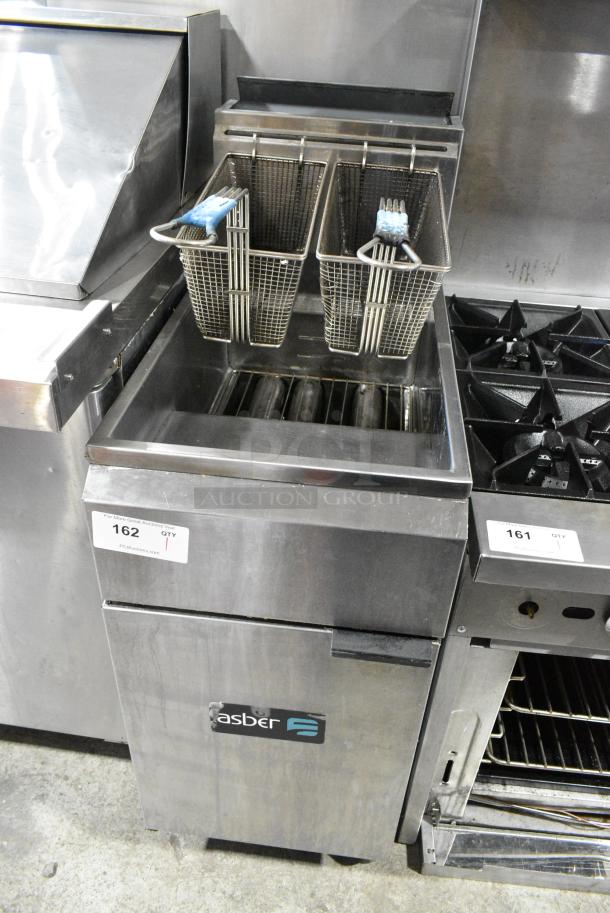Asber Stainless Steel Commercial Floor Style Natural Gas Powered Deep Fat Fryer w/ 2 Metal Fry Baskets on Commercial Casters. - Image 1 of 7