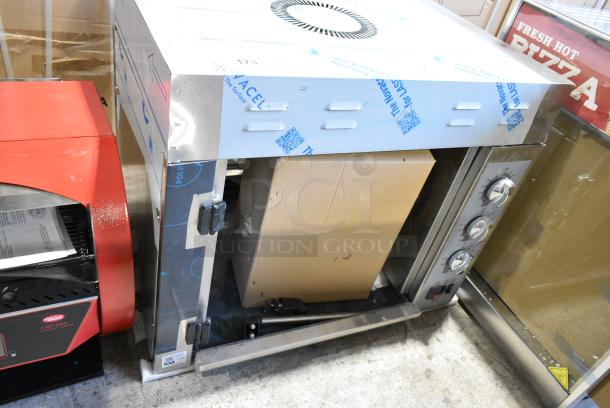 BRAND NEW SCRATCH AND DENT! Cooking Performance Group CPG Stainless Steel Commercial Countertop Electric Powered Rotisserie Oven. 240 Volts, 1 Phase. - Image 1 of 4