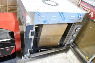 BRAND NEW SCRATCH AND DENT! Cooking Performance Group CPG Stainless Steel Commercial Countertop Electric Powered Rotisserie Oven. 240 Volts, 1 Phase.