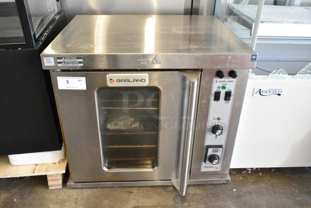 LIKE NEW!  Garland Master 200 Stainless Steel Commercial Electric Powered Half Size Convection Oven w/ View Through Door, Metal Oven Racks and Thermostatic Controls. 208/240 Volts, 1 Phase. - Image 1 of 5
