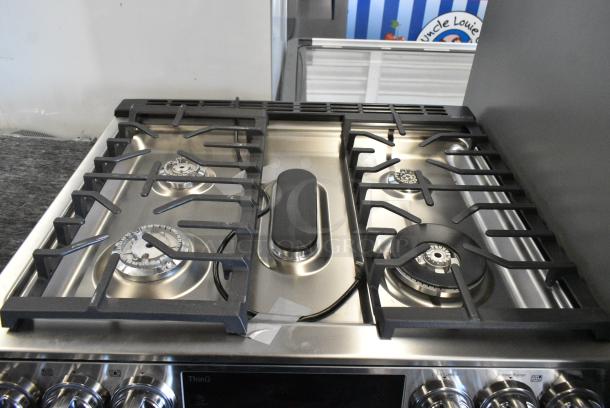 BRAND NEW SCRATCH AND DENT! ThinQ Stainless Steel Natural Gas Powered  4 Burner Range w/ 2 Ovens. See Pictures for Lower Oven's Broken Glass. - Image 4 of 9