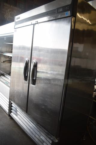 Master-Bilt R49-S Stainless Steel Commercial 2 Door Reach In Cooler w/ Poly Coated Racks on Commercial Casters. 115 Volts, 1 Phase. Tested and Powers On But Does Not Get Cold