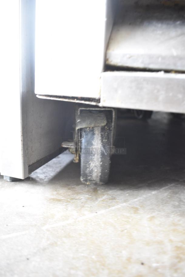 Master-Bilt R49-S Stainless Steel Commercial 2 Door Reach In Cooler w/ Poly Coated Racks on Commercial Casters. 115 Volts, 1 Phase. Tested and Powers On But Does Not Get Cold - Image 4 of 7